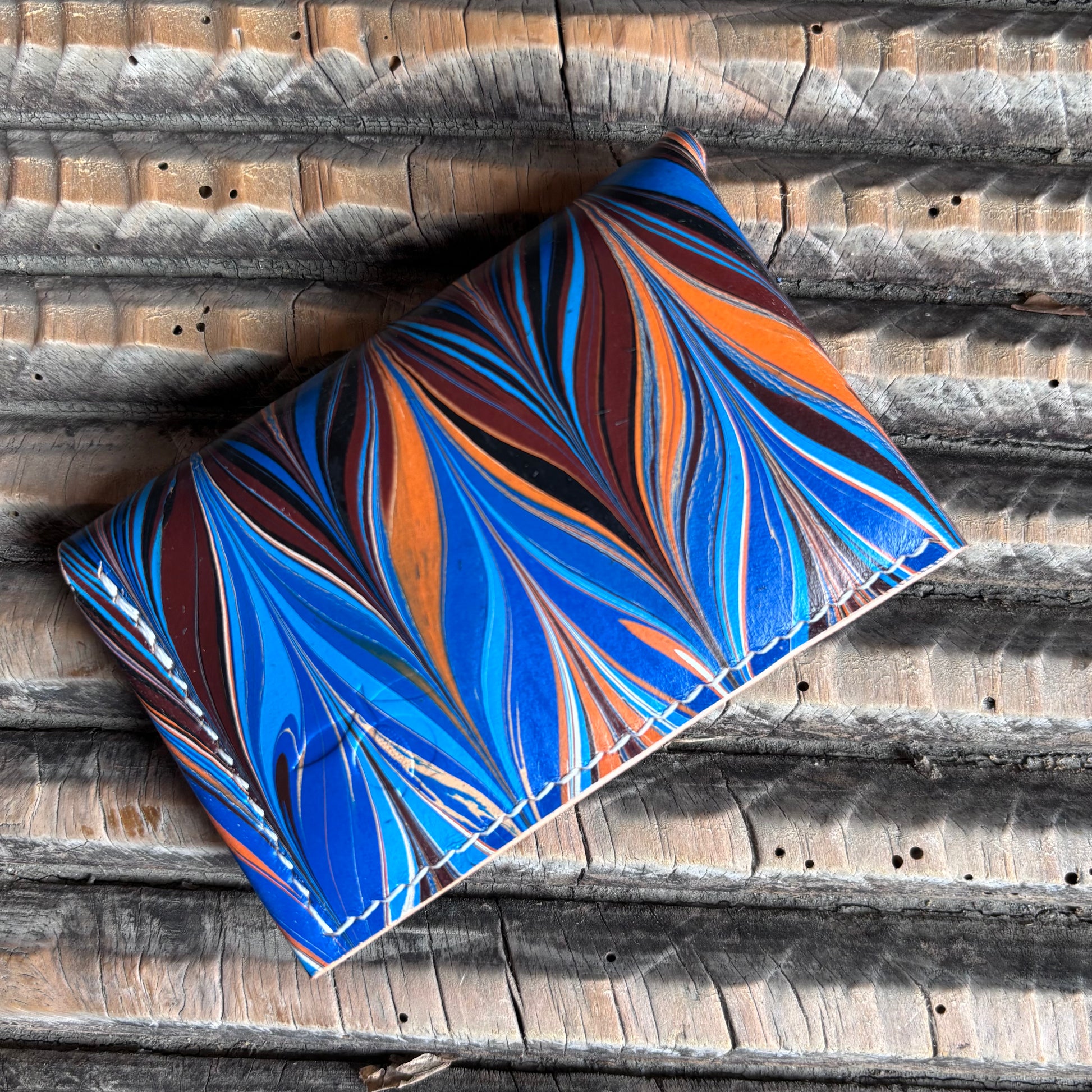 Abrazo - Hand-marbled blue, orange, brown